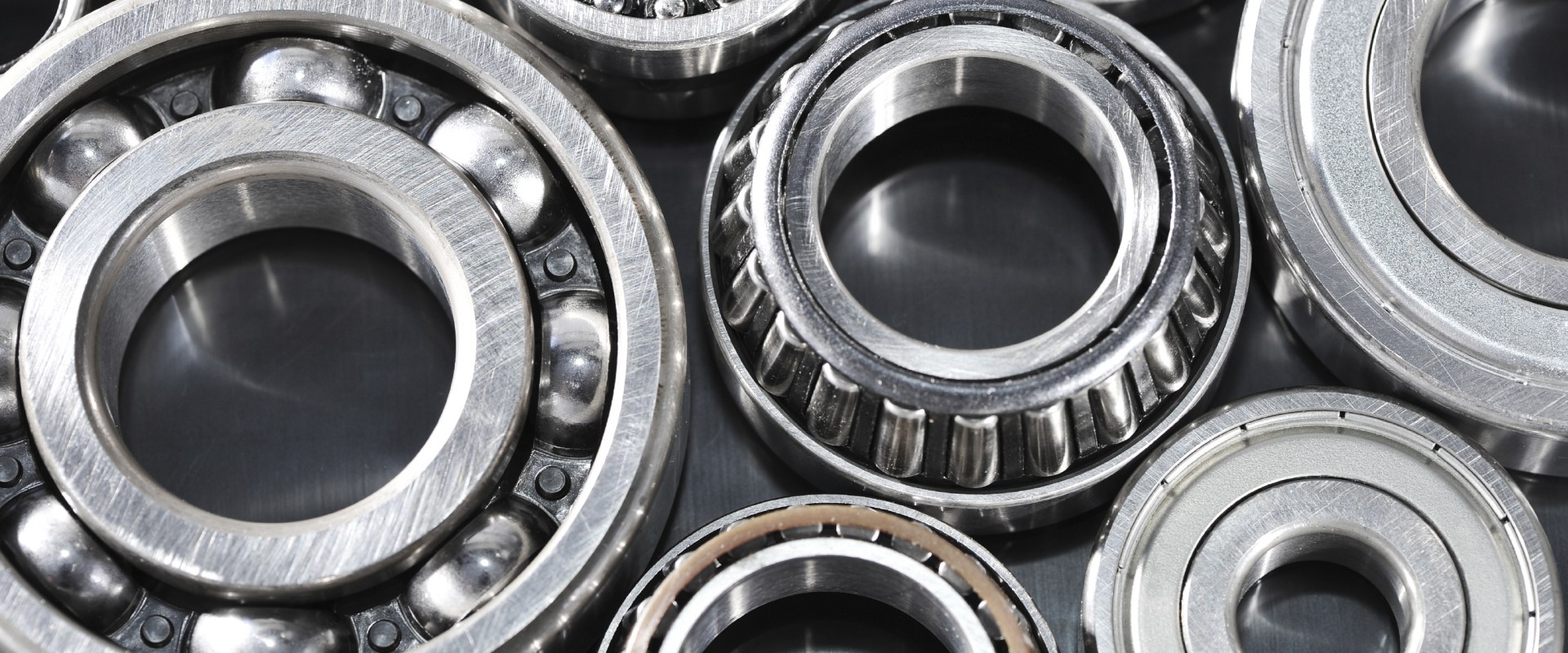How should used wheel bearings cleaned before inspection?