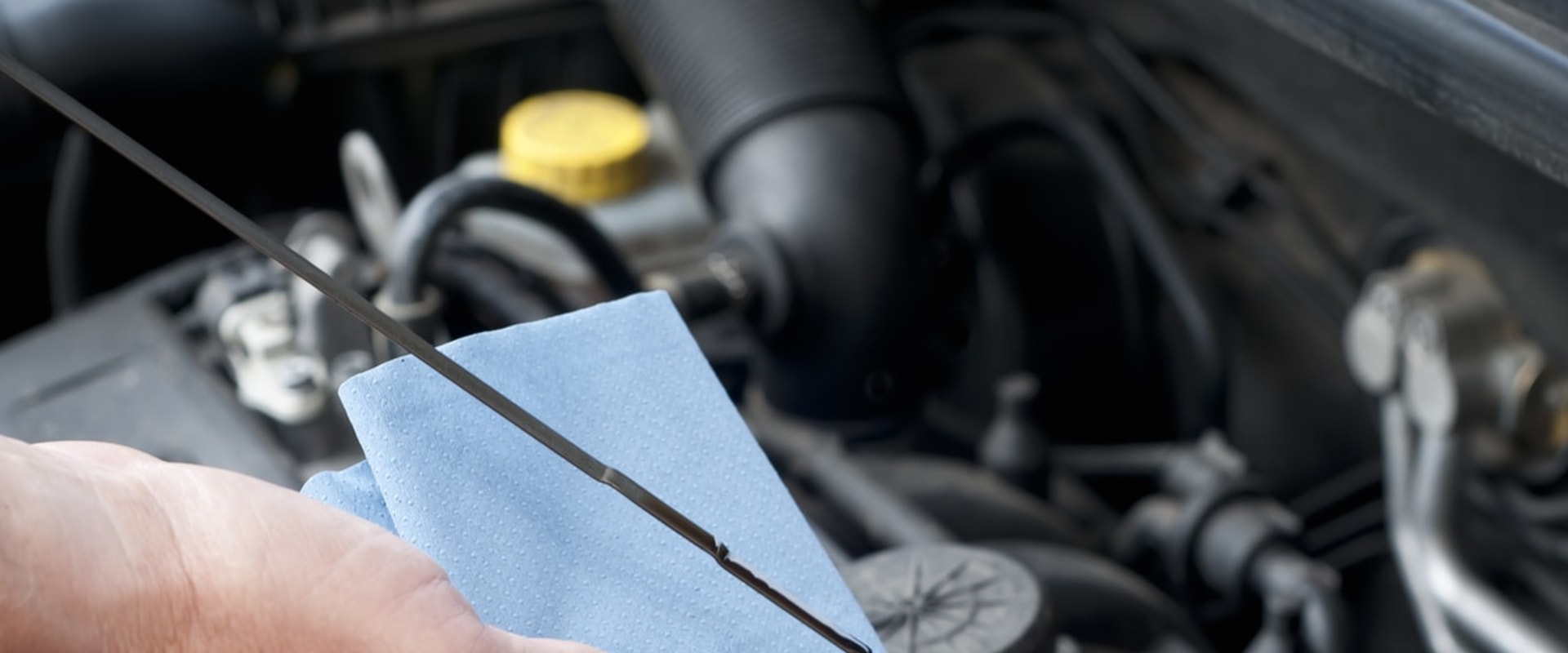 Which fluids must be checked when the car is cold?