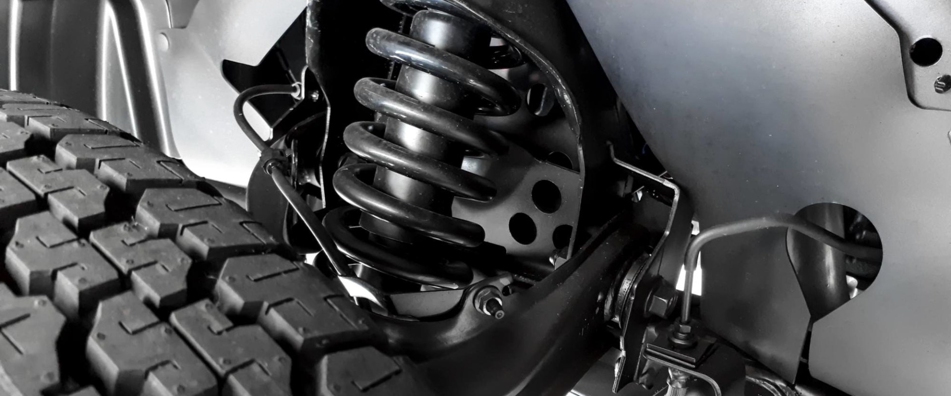 How do you inspect steering and suspension components?