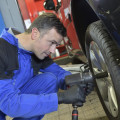 What are five hazards safety concerns or dangers that an automotive technician needs to be aware of while working in the auto shop?