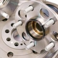 How does a technician check for a loose wheel bearing?