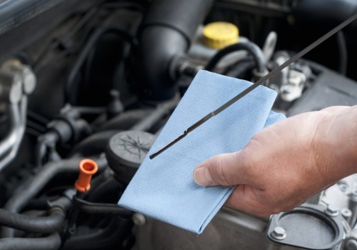 Which fluids must be checked when the car is cold?